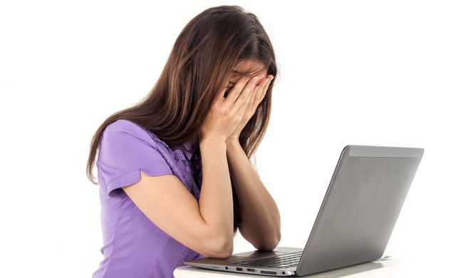 Woman worrying about some loss on the computer